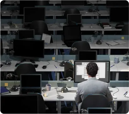 A person sitting alone in office and working on PC